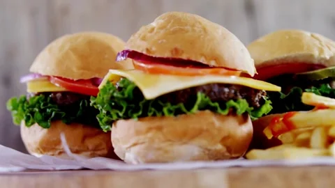 BIG Hamburger or cheeseburger with cutlets, Delicious hamburger background. food Stock-Footage 336579581