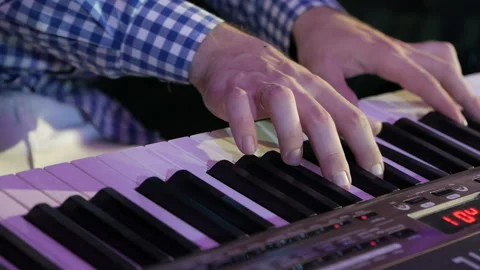 Big hands on the keys of the synthesizer. Stock Footage 143306762