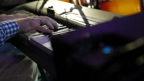 Big hands on the keys of the synthesizer. Stock Footage 143307178
