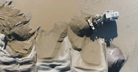 Big heavy  wheel loader moves sand Stock Footage 159437919