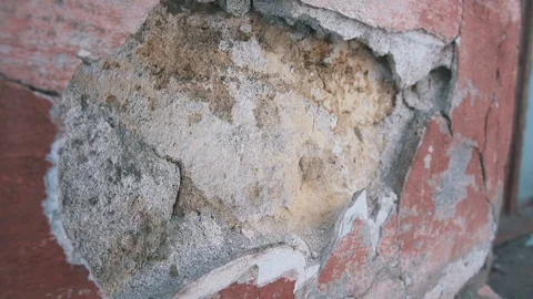 Big hole in destroyed brick wall of old building Stock Footage 105127140