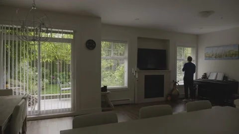 Big house inside. The owner opens the blinds. Stockbeeldmateriaal 153931958