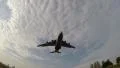 Big huge plane sits on a background of blue sky with clouds. HD Footage