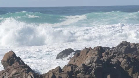 Big huge stormy sea waves crashing on rocky craggy beach, California ocean coast Stock Footage 178281178