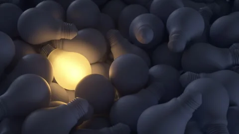 Big ideas. Illuminated light bulb among the rest of the unlit bulbs. Vídeos de archivo 336400855