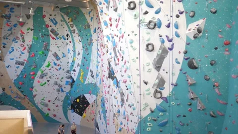 Big indoor hall with climbing wall for trainings Stock Footage 219769677