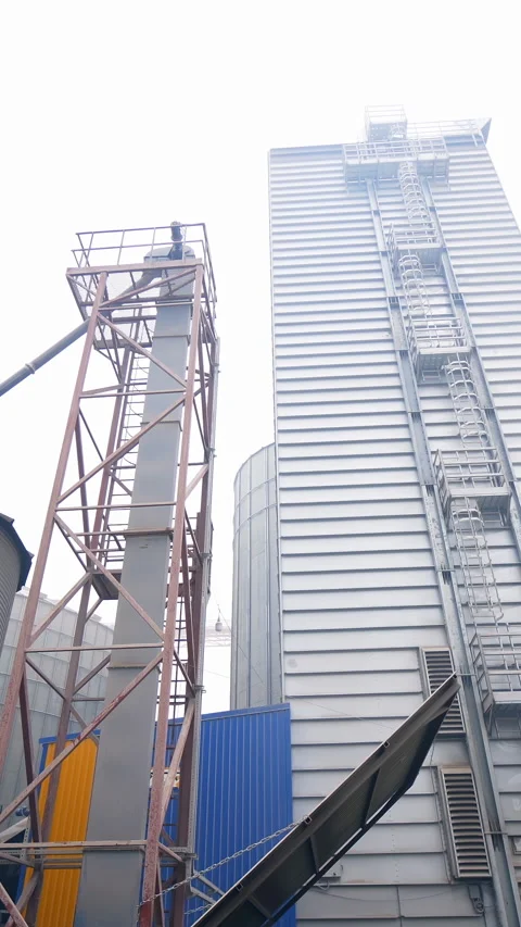 Big industial elevator construction. Huge metal agricultural architecture. Stock Footage 317939018