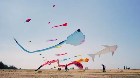Big Inflatable stingray and shark Kites Flying on The Beach Stock Footage 53230020