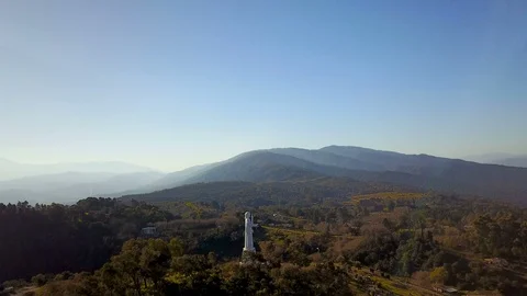 Big Jesus Statue on top of mountain with blue sky Stock Footage 88855215