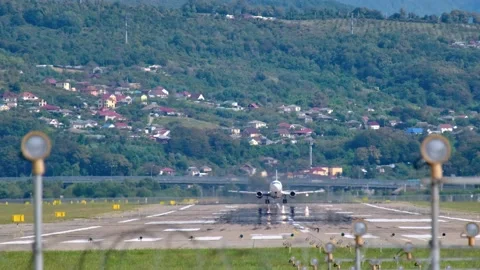 Big jet plane on blue cloudy sky background. Sochi Airport in the afternoon. Vidéo 146597691