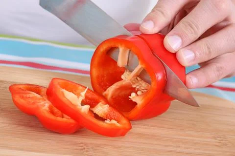 Big knife cutting red pepper Stockfoto's