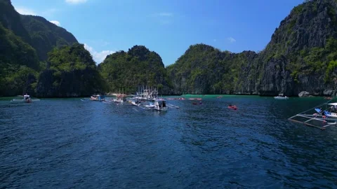 Big Lagoon in El Nido limestone karsts with kayakers. Nice aerial view drone Stock Footage 344595498