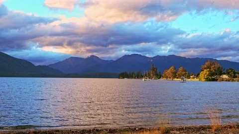 Big lake in Te Anau at sunset, New Zealand at sunset 스톡 동영상 78739904