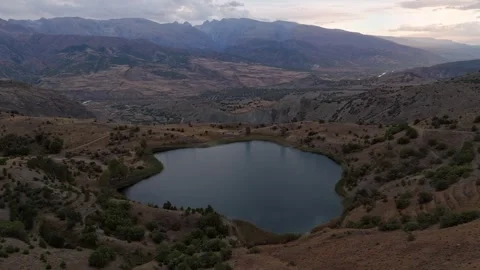 A big lake at the top of the mountain Stock Footage 330532875