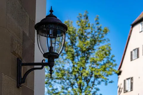 Big lantern on the wall of a historical building Stock Photos