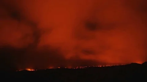 Big lava flow timelapse night to day sunrise dawn Night Glowing Hot flow from Stock Footage 81590763