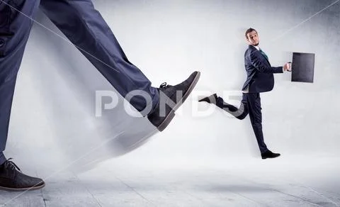 Big leg kicking small man Stock Photos