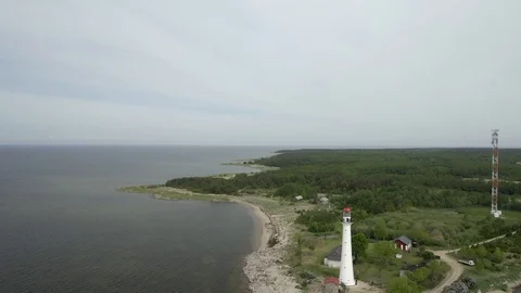 Big lighthouse on the beach Stock Footage 119398147