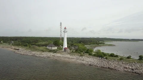 Big lighthouse on the beach Stock Footage 119398148