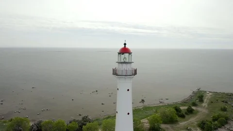 Big lighthouse on the beach Stock Footage 119398149