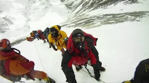 Big line of climbers on Mt. Everest waiting and resting Stock Footage