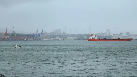 Big loaded cargo ship swims ashore of the Istanbul port. Transportation, high 스톡 동영상 105273300
