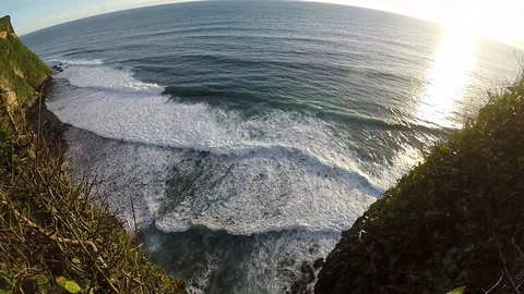 Big long waves from a bird's eye view at sunset Stock Footage 88110507
