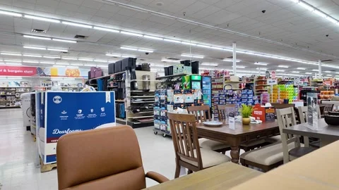Big Lots store, interior products, furniture and staff member stacking boxes Stock Footage 279026159