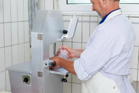 Big lump of meat in the mincing machine Stock Photos