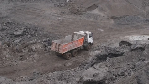 Big machine in the quarry waste slag Stock Footage 99884020