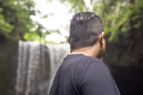 The big man looked back. Abstract background and waterfall bokeh. Nice illust Foto stock