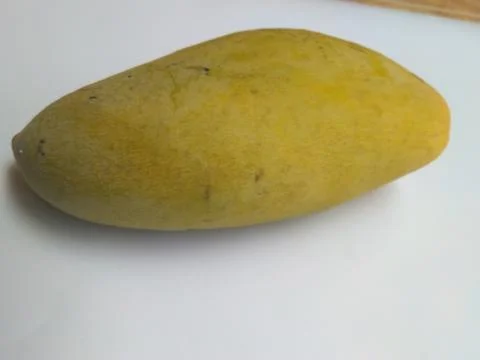 A big mango on the white background Stock Photos
