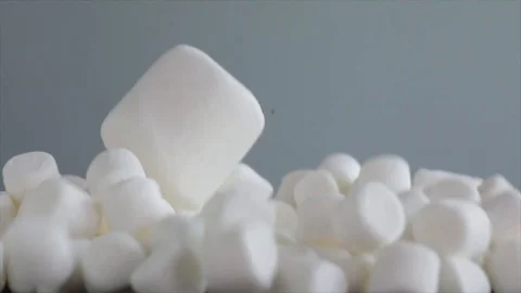 Big Marshmallow falls on small Marshmallows Stock Footage 99163855