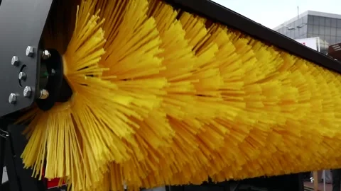 Big massive rotating brush , special machinery for roads cleaning, snow Stock Footage 149805987