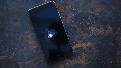 Big modern smartphone with broken screen debris Stock Footage 85631707