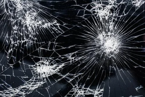 Big modern smartphone with broken screen debris Stock Photos