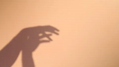 Big monster claw shadow on wall. Horror hand shadow on a white background Stock Footage 204968894
