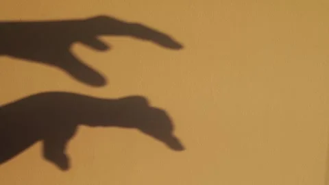 Big monster claw shadow on wall. Horror hand shadow Stock Footage 251800039