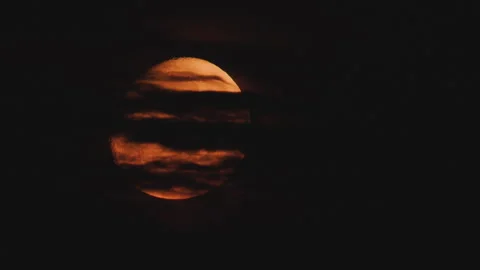 Big moon comes through the clouds Stock Footage 322776017