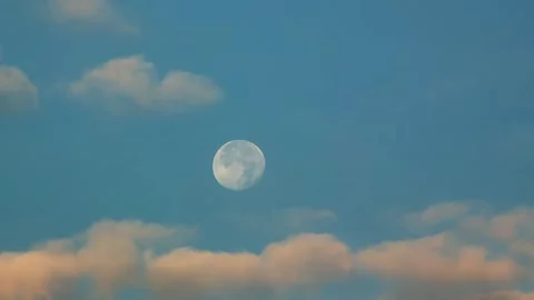 Big moon during the day. Time lapse of moon and clouds with clear blue sky Stock Footage 252018774