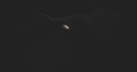 Big moon eclipse behind night clouds, timelapse Stock Footage 86309617