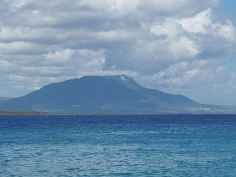 Big mountain in the background of the ocean Stock Photos