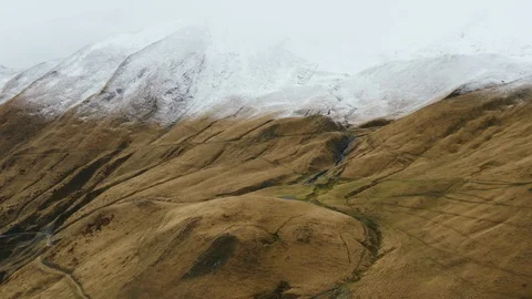 Big mountain in the clouds. Snow at the top. Stock Footage 122824228