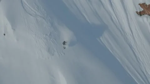 Big Mountain Freeride Skiing Down Extreme Alaskan Powder Slopes with Sluff Stock Footage 339316530