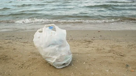 Big mountain of garbage on the sea beach, sea and water pollution concept. Tr Stock Footage 203788267