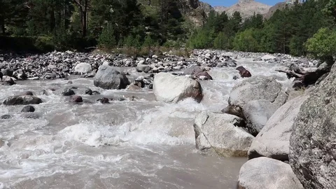 Big mountain river flows between stones Stock Footage 118251874