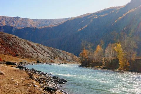 Big mountain river with strong current in mountain Stock Photos