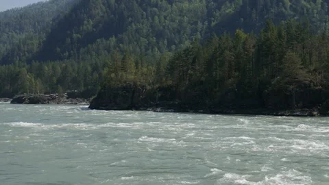 Big mountain river surrounded by mountains and trees Stock Footage 248203929