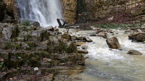 Big mountain waterfall after the rain. Vertical panning. Stock Footage 77007550