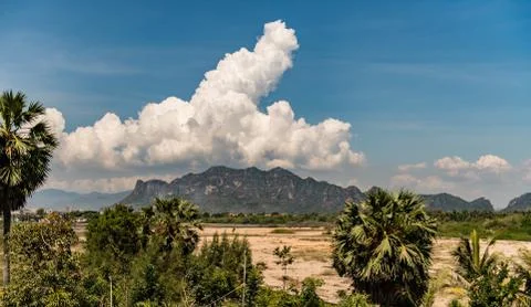 Big mountain with white big cloud Stock Photos